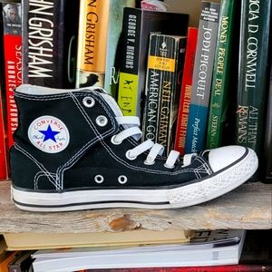 Boys size 5 black and white Convers shoes with velcro back and elastic laceses.